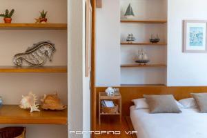 Postel nebo postele na pokoji v ubytování Giada by PortofinoVip