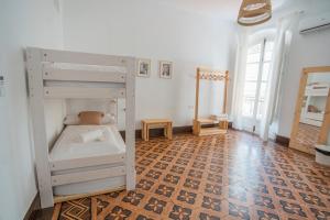 Postel nebo postele na pokoji v ubytování Casa de la Alegría