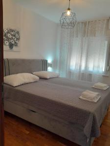 Ein Bett oder Betten in einem Zimmer der Unterkunft Apartmants Matić
