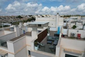 an aerial view of a balcony of a building at Luxurious flat & private rooftop in Villamartin Orihuela Costa in Orihuela Costa