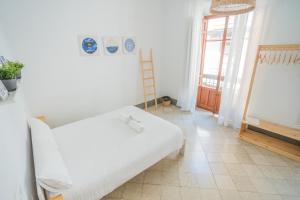 Postel nebo postele na pokoji v ubytování Casa de la Alegría