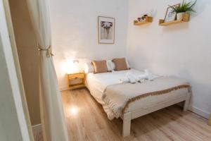 Postel nebo postele na pokoji v ubytování Casa de la Alegría