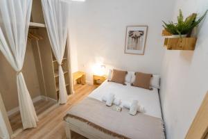 Postel nebo postele na pokoji v ubytování Casa de la Alegría