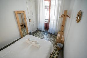 Postel nebo postele na pokoji v ubytování Casa de la Alegría