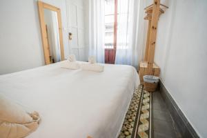 Postel nebo postele na pokoji v ubytování Casa de la Alegría