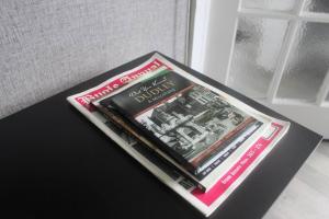 a pile of books sitting on top of a table at West Midlands Contractors, Nurses and Families 