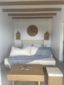 A bed or beds in a room at Sohoros Luxury Suites