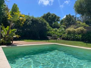 a swimming pool in the yard of a house at A House in The Woods in Sintra