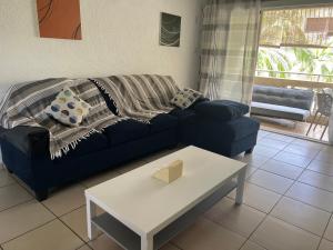 Predel za sedenje v nastanitvi Apartment Tamarinier Complexe