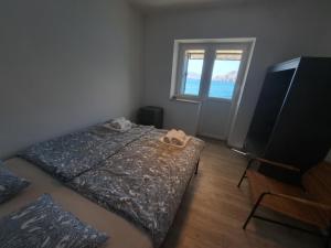 En eller flere senge i et værelse på Apartment Grandić