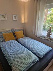Postel nebo postele na pokoji v ubytování Ferienwohnung Frau Hansen
