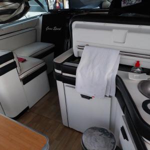 a white towel is hanging from the back of an rv at l ile sur mer in Empuriabrava