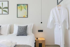 Posteľ alebo postele v izbe v ubytovaní Krystallon Villas