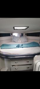 a bed in the back of a boat at l ile sur mer in Empuriabrava