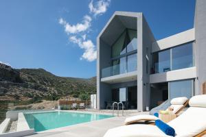 an image of a house with a swimming pool at Krystallon Villas in Palaiochora