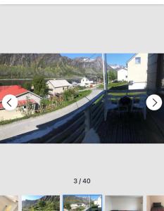 a picture of a balcony with a view of a house at Senja Villa in Gryllefjord