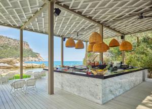 a bar on the beach with a view of the ocean at Maxx Royal Kemer Resort in Kemer