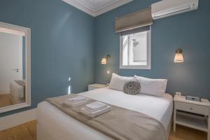 Säng eller sängar i ett rum på Bolhão - Garden Apartment
