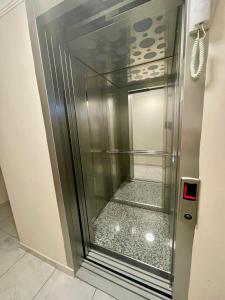 a refrigerator with a glass door in a room at Timeks Suite Sultanahmet in Istanbul