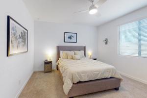 a bedroom with a large bed with two night stands at Phoenix Star in Phoenix