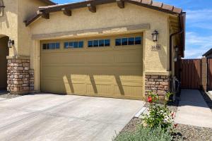 a garage door of a house with a driveway at Phoenix Star in Phoenix