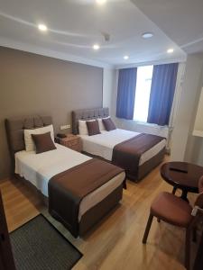 Postel nebo postele na pokoji v ubytování Hotel Silviya