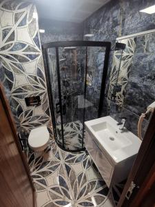 Koupelna v ubytování Hotel Silviya