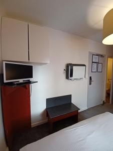 TV a/nebo společenská místnost v ubytování Hotel Koffieboontje