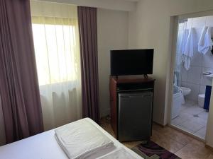 Et tv og/eller underholdning på Casa de Vacanță Topaz