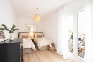 Postel nebo postele na pokoji v ubytování Sunny Villa Roselani