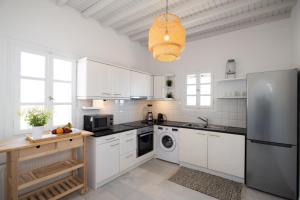 Kuchyň nebo kuchyňský kout v ubytování Sunny Villa Roselani