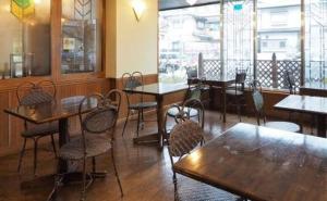 a dining room with tables and chairs in a restaurant at Hotel Terminal Inn in Niigata