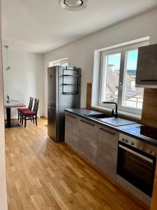 Kuchyň nebo kuchyňský kout v ubytování Athecada Apartments