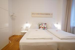 Postel nebo postele na pokoji v ubytování Athecada Apartments