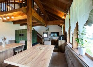 a dining room with a wooden table in a house at Haus Uhlennest in Ühlingen-Birkendorf