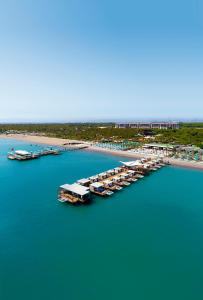 an aerial view of a harbor with boats in the water at Regnum Carya in Belek