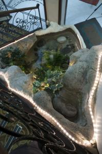 a stone planter with plants in it at Hali Hotel in Istanbul