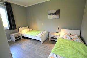 Postel nebo postele na pokoji v ubytování Am alten Speicher 4