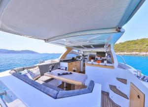 a view from the back of a boat with a table and chairs at Blue Neptune Yacht in Kaş