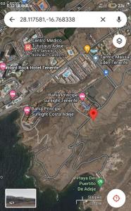eine Karte einer Stadt mit einem roten Punkt in der Unterkunft Tenerife Van Mercedes for drive in Canary island in Adeje