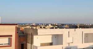 a view of a city from the roof of a building at DarAttiaKelibia in Kelibia