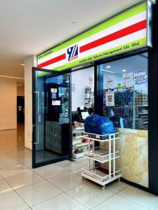 a store in a shopping mall with its door open at Cozy Couple Suite at Trefoil Setia Alam in Shah Alam +8 photos