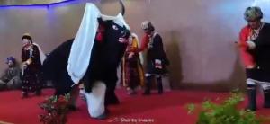 a man in a black and white wedding dress dancing at The Royal Maryul Banquet Hall , Restaurant & Resort - Leh in Stak