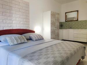 Postel nebo postele na pokoji v ubytování Apartments Helena