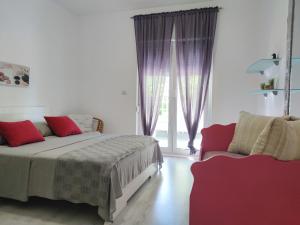 Postel nebo postele na pokoji v ubytování Apartments Helena