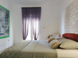 Postel nebo postele na pokoji v ubytování Apartments Helena