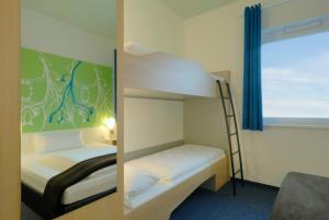 Postel nebo postele na pokoji v ubytování B&B Hotel Paderborn