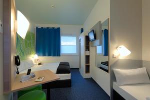 Postel nebo postele na pokoji v ubytování B&B Hotel Paderborn
