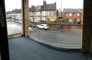 a view from a window of a street with houses at London Anayah apartments in London
