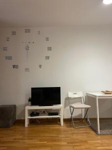 a living room with a tv on a white wall at Belgrade with love in Novi Beograd